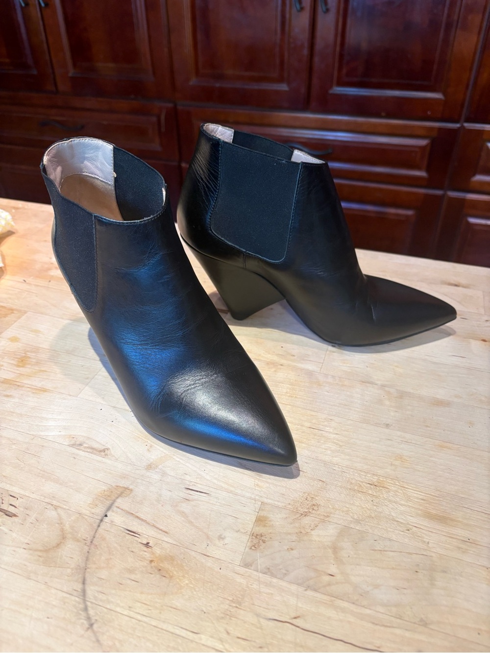 Sleek Black Pointed Leather Ankle Booties with Angled Block Heel